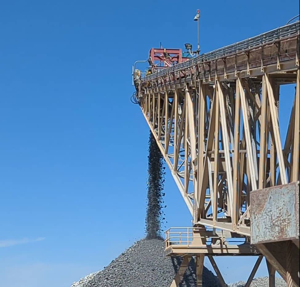 Dust suppression on stacker at mining and material operation