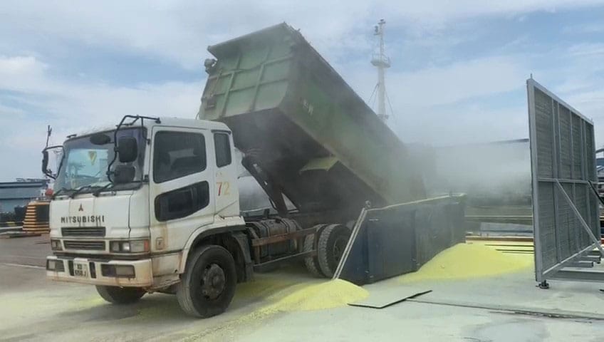 Dust suppression on truck dump at marine and rail terminal