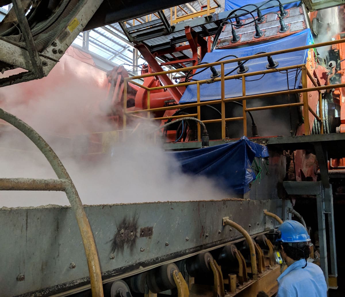 Dust suppression on conveyor transfer point