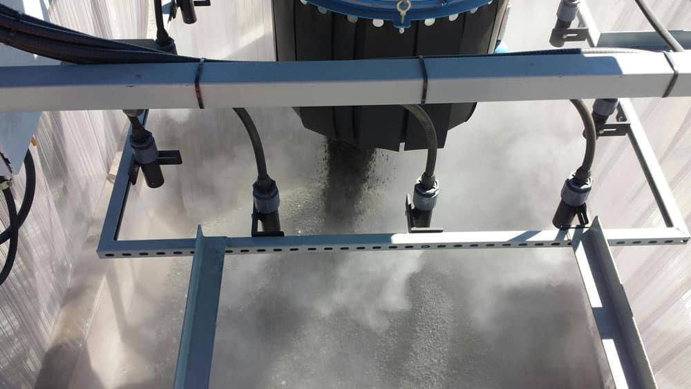 Dust suppression on feed hopper at aggregate, cement and sand operation