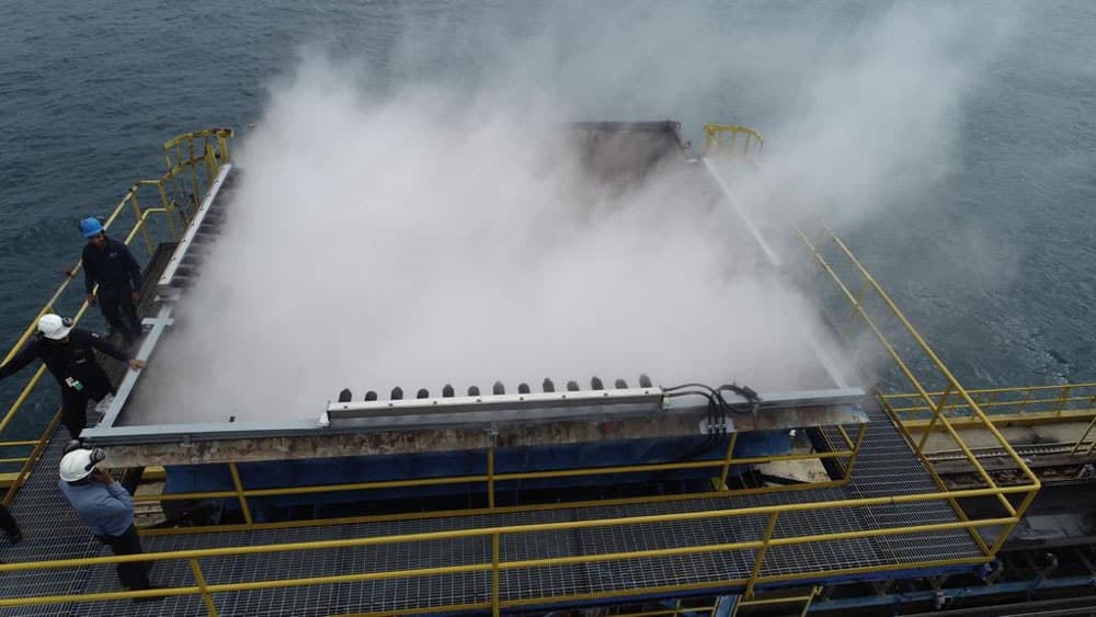 Dust suppression on feed hopper at power generation operation
