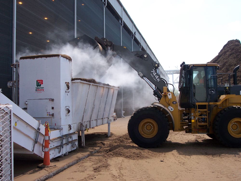 Dust suppression on feed hopper at pulp and paper operation