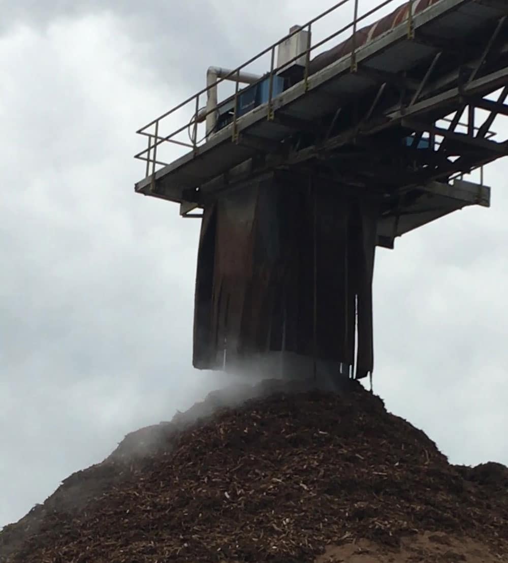 Dust suppression on stacker at pulp and paper plant